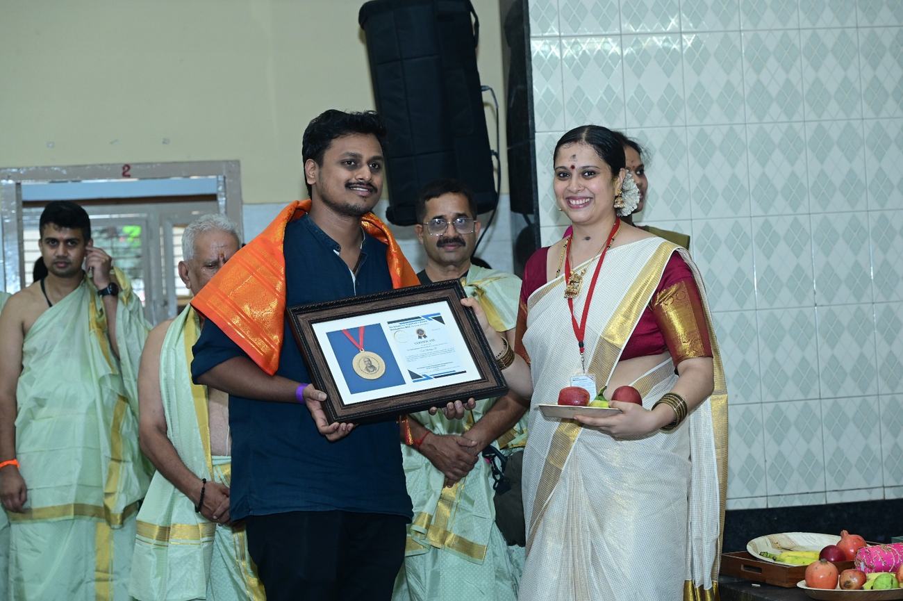 Smt. Chaitanya R receiving the Paramahamsa Dhruva Award